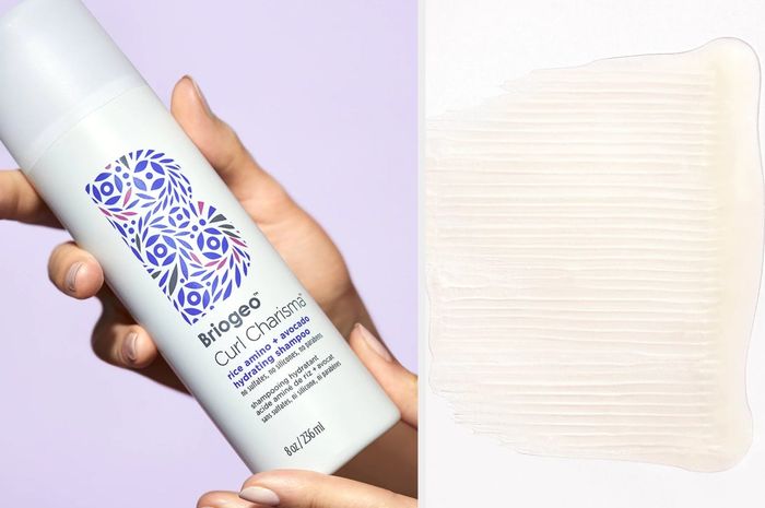 Model holding a white shampoo bottle with a purple graphic of a B, showcasing the clear texture of the product against a white background.