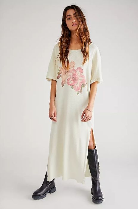 A model wearing the dress paired with black boots