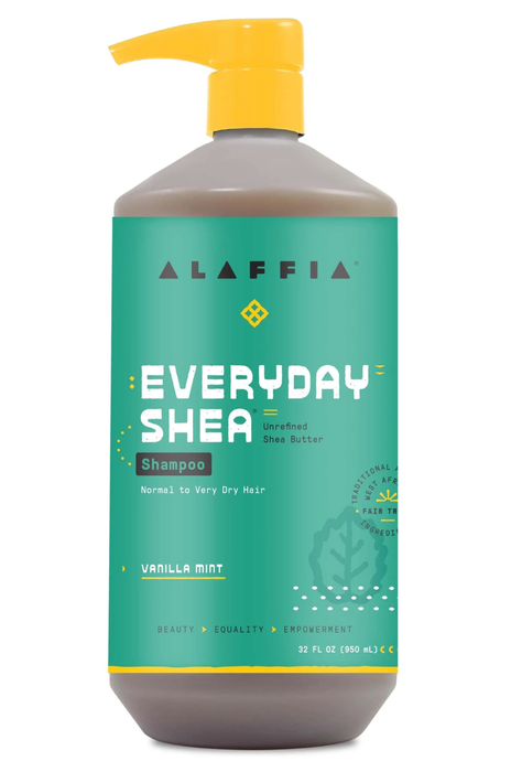 A green shampoo bottle with a yellow pump placed against a white background.