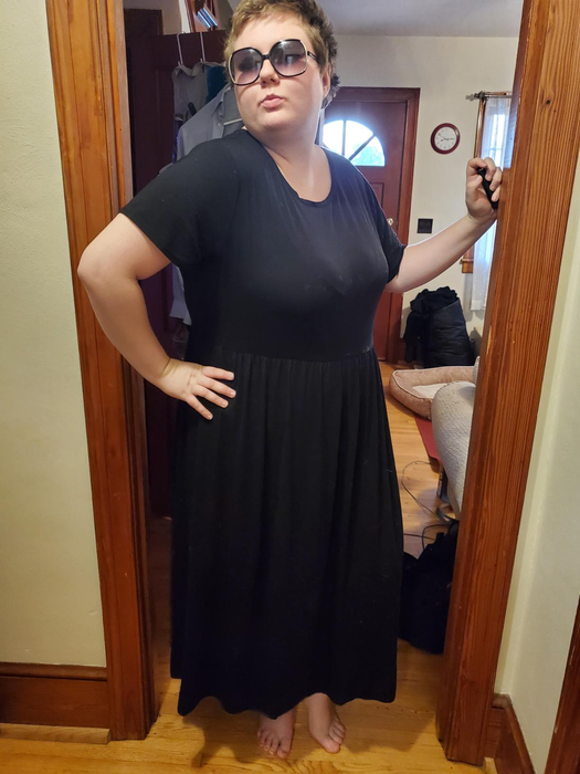 a reviewer wearing the short sleeve maxi dress in black