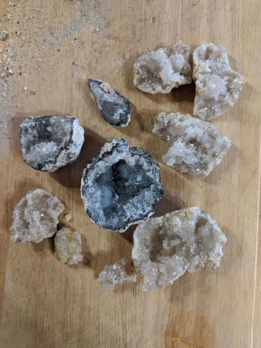 A reviewer's geodes split open to reveal the sparkling crystals inside
