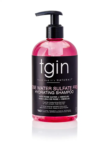 A clear and black bottle of shampoo with pink formula and a black pump, set against a white background.