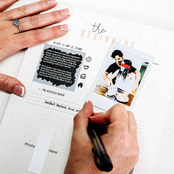 Model filling out pages in the adventure book