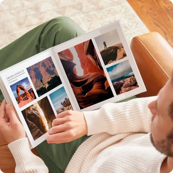 a photo book opened to reveal pictures of the Grand Canyon