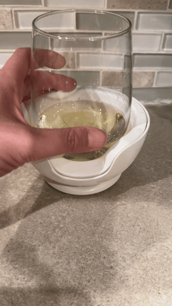 A GIF demonstrating how easy it is to lift the wine glass from the chiller, showing how simple and convenient it is to use.