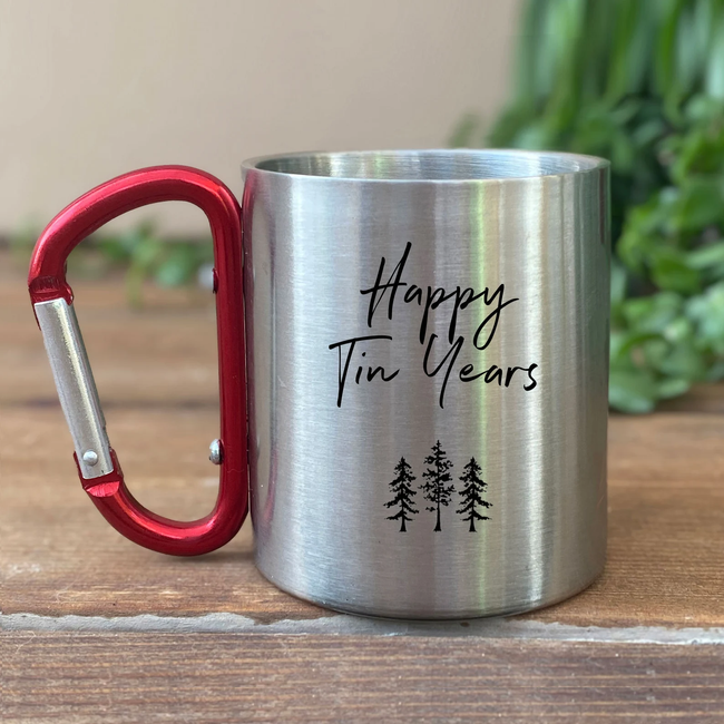 tin mug with carabiner handle. The mug reads 'Happy Tin Years.'
