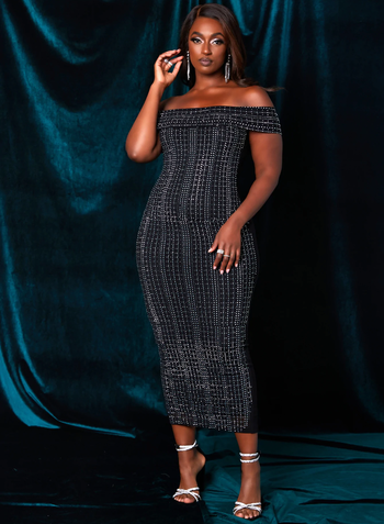Another model pairing the dress with silver heels.