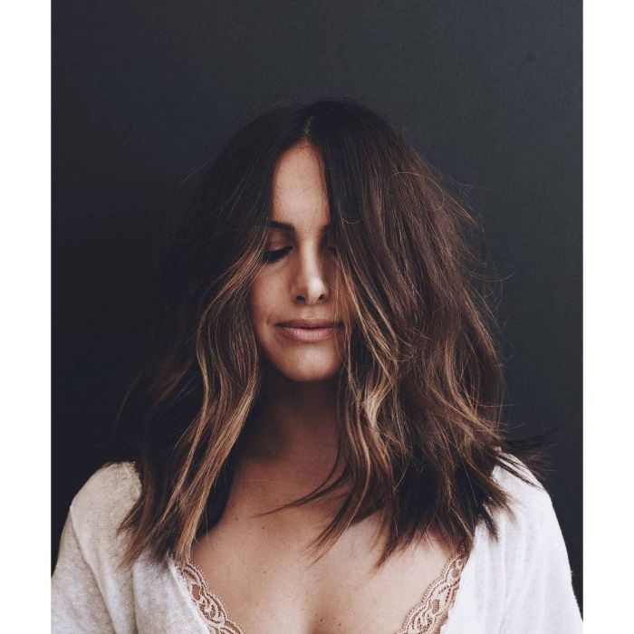 Model showing off her hair after using texture spray