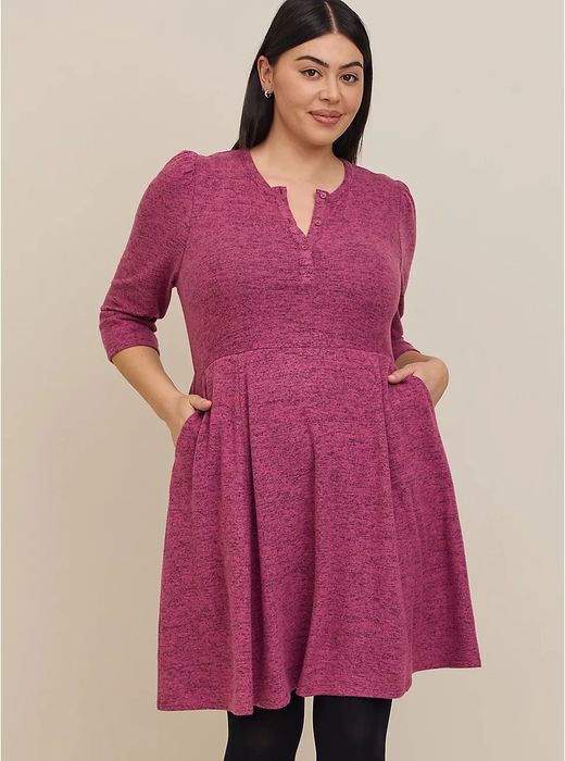a model wearing the knit skater dress in pink