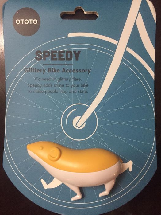 A bike accessory that attaches to the spokes, cleverly designed to resemble a hamster.