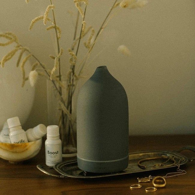 A stone diffuser in gray with a sleek, tapered end.