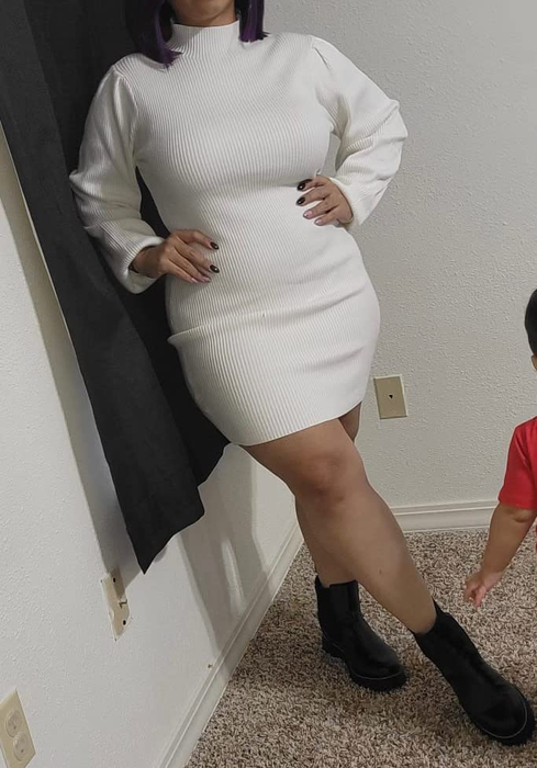 a reviewer styled in the rib-knit long sleeve dress in white