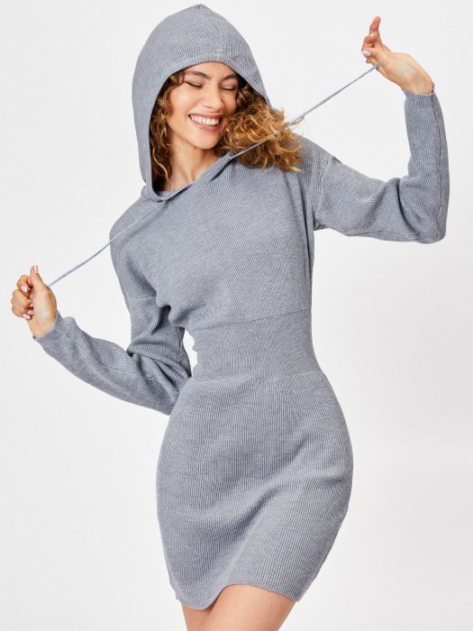 a model showcasing a ribbed gray dress with a hood