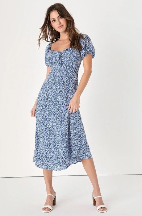 A model is wearing the blue floral midi dress