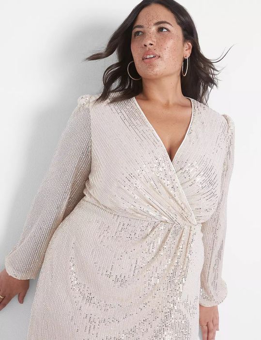 A close-up shot of the same model in the white sequined dress.