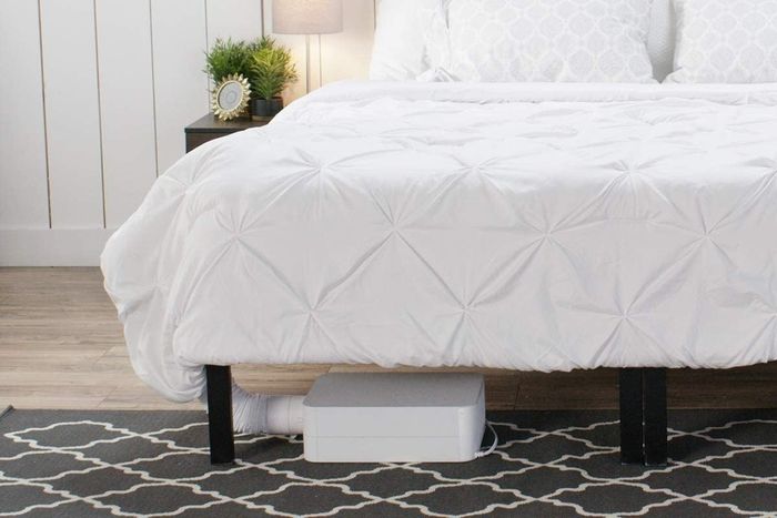 The white unit with a tube running under the bed's sheets for an efficient setup