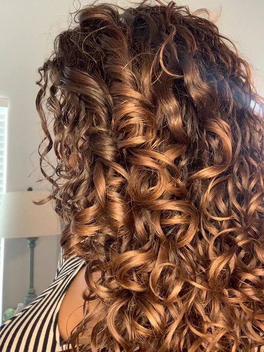 A reviewer's beautifully defined curly hair