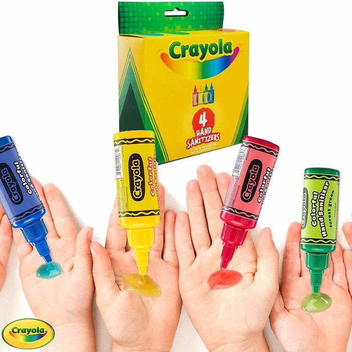 Four crayon-shaped hand sanitizer containers releasing vibrant liquid onto hands