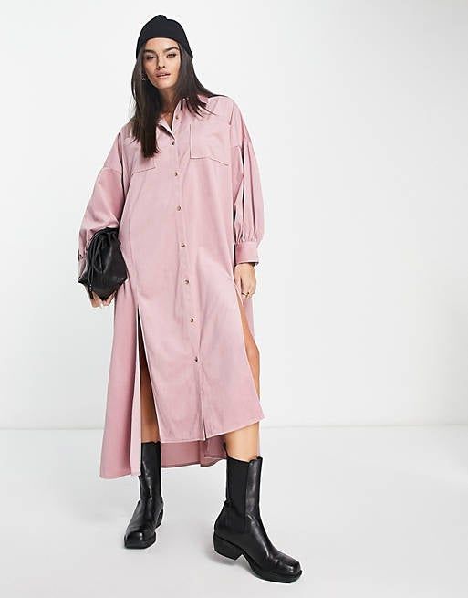 a model sporting an oversized shirt dress in pink