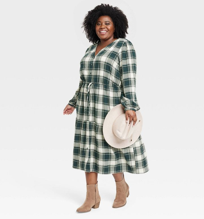 a model showing off a green plaid long sleeve midi dress