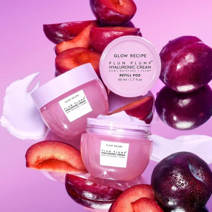 pink jars of the moisturizer lined up on a shelf
