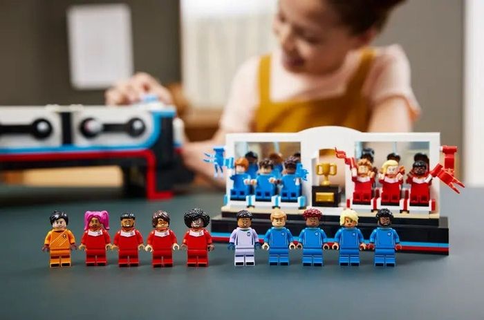 Close-up of Lego minifigs cheering from the stands
