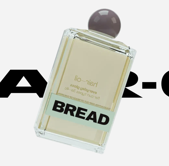 A bottle of Bread Beauty Supply hair oil.