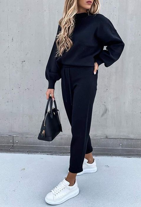 A model wearing the set in navy blue.