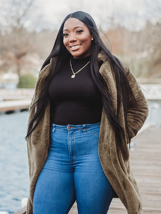 A reviewer sporting the coat in deep brown.