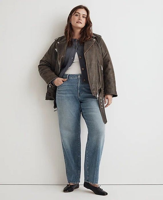 A model wearing light wash denim straight-leg jeans, offering a relaxed yet stylish vibe.