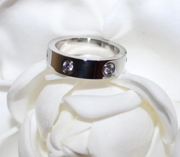 A silver ring featuring embedded cubic zirconia