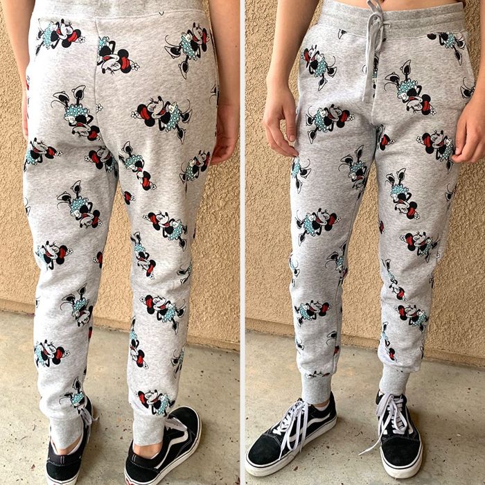 a reviewer wearing gray joggers with Minnie Mouse prints