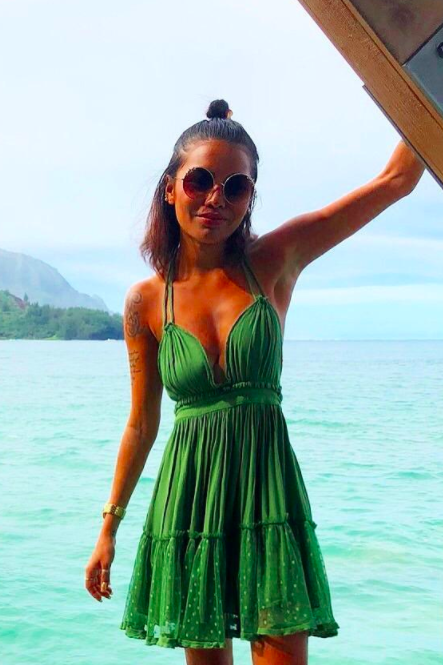 A customer review photo displaying the halter dress in green.