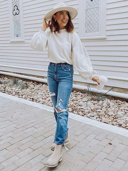 A model sporting the top in a clean white shade.