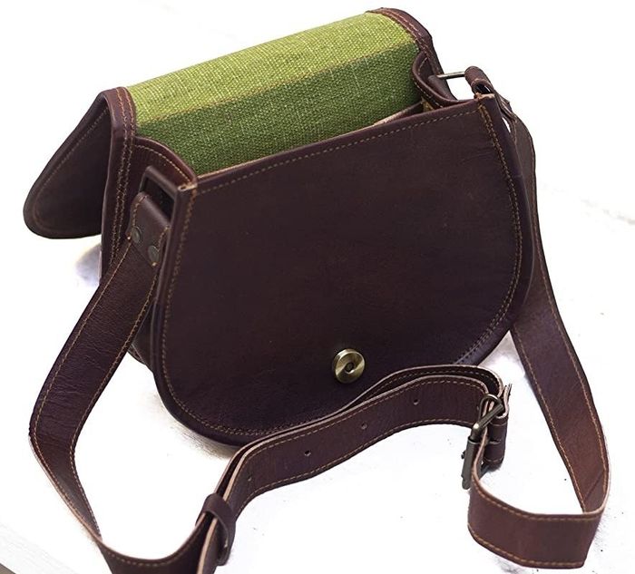 The bag is opened to reveal its green interior.