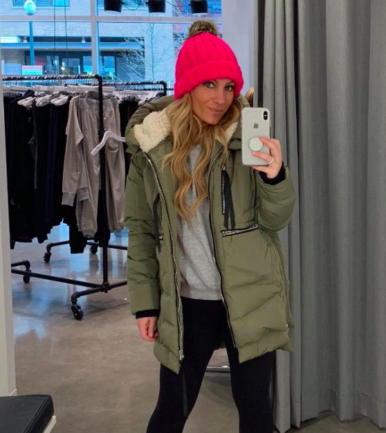 A customer-provided image showing them wearing the jacket in a vibrant green color.