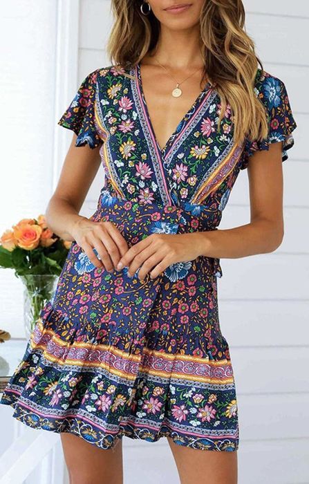 A model rocking the swing dress in navy.