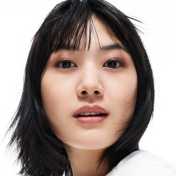 A model showcasing the contour stick with clear shading on their face.