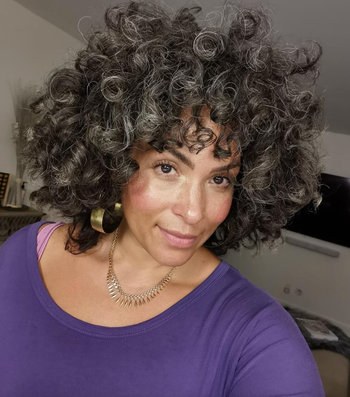 A reviewer wearing the Lumi Glotion