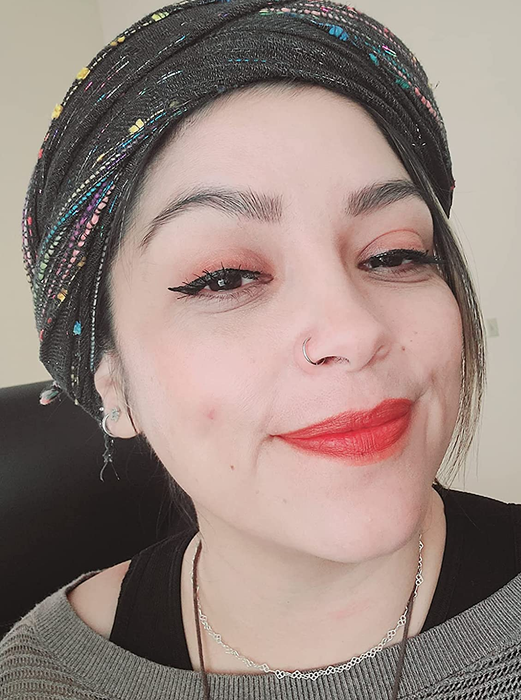 A reviewer showcasing how they used the Huestick Corrector on their face.