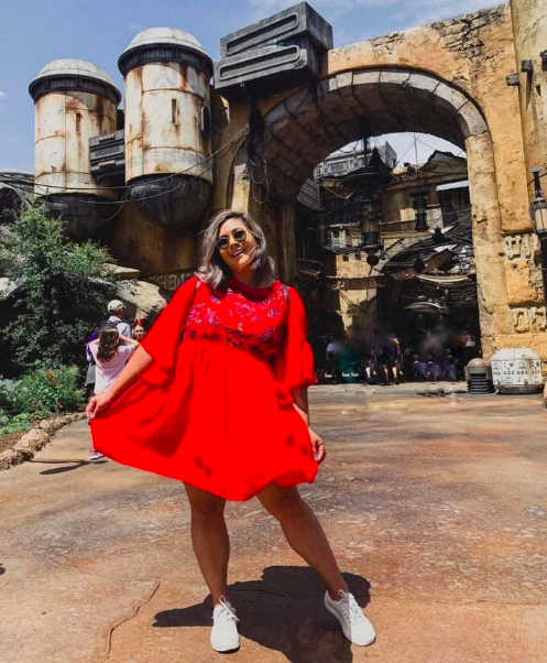A customer review photo of the babydoll dress in red.