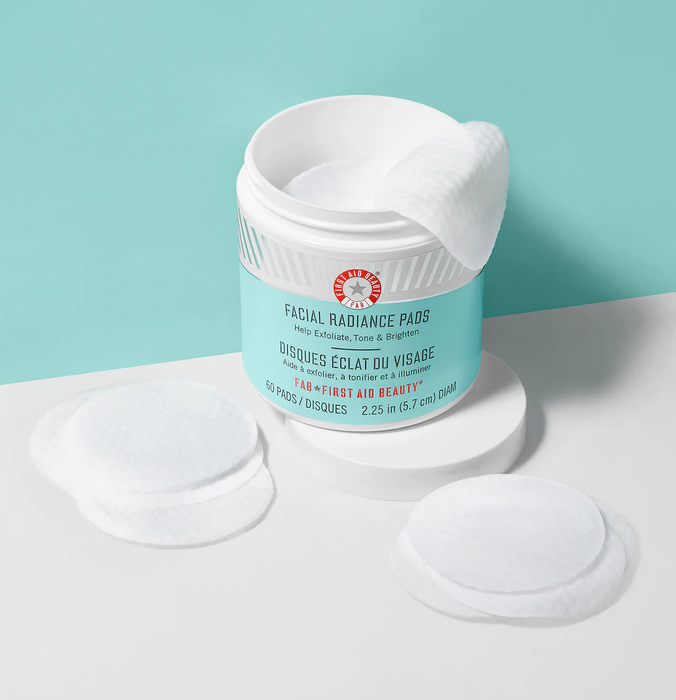 Green and white tub of facial radiance pads