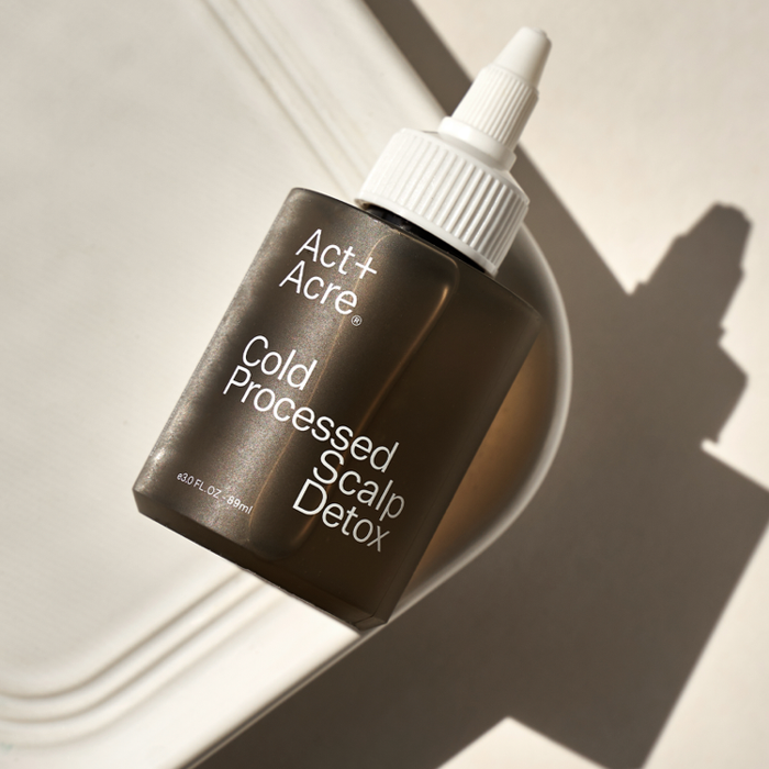 A bottle of Act and Acre Cold Processed Scalp Detox.