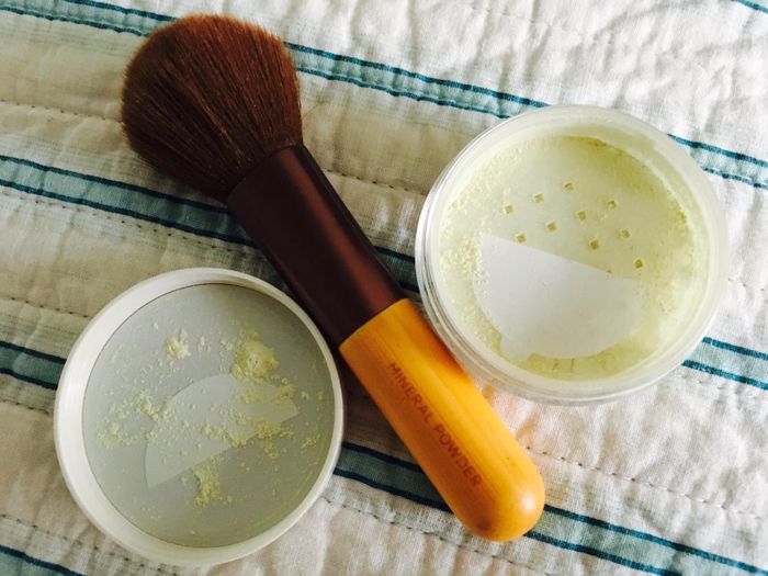 The powder placed next to a brush.