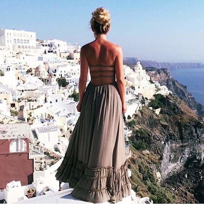 A rear view of the open-back maxi dress.
