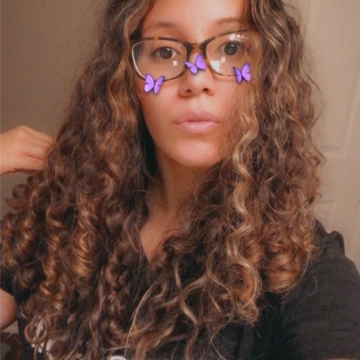 On the left, a reviewer with long, golden-brown curly hair