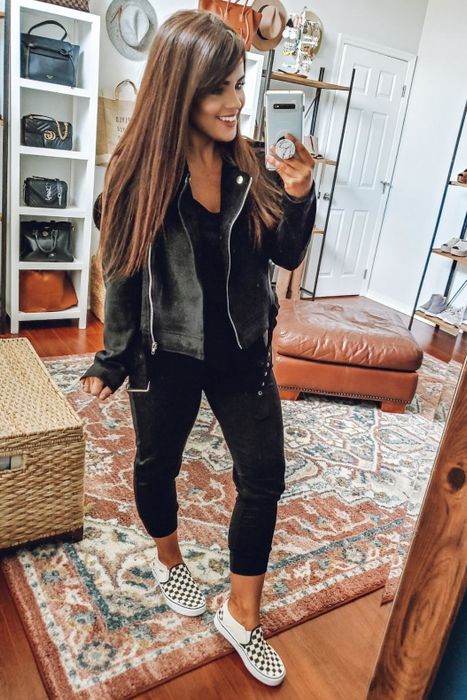 A reviewer rocking the coat in sleek black.