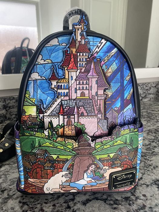 A Beauty and the Beast backpack featuring a stunning stained glass design, capturing the magic of the classic film.