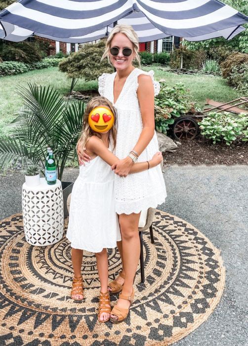 A reviewer rocking the white smock dress.