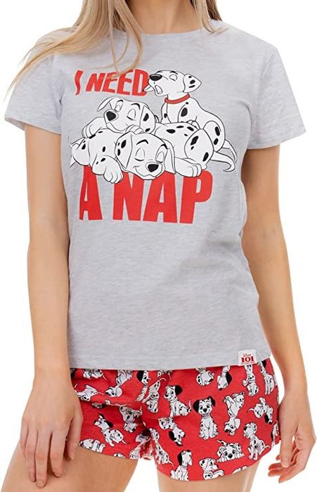 a model wearing a gray t-shirt featuring Dalmatian puppies with a playful phrase
